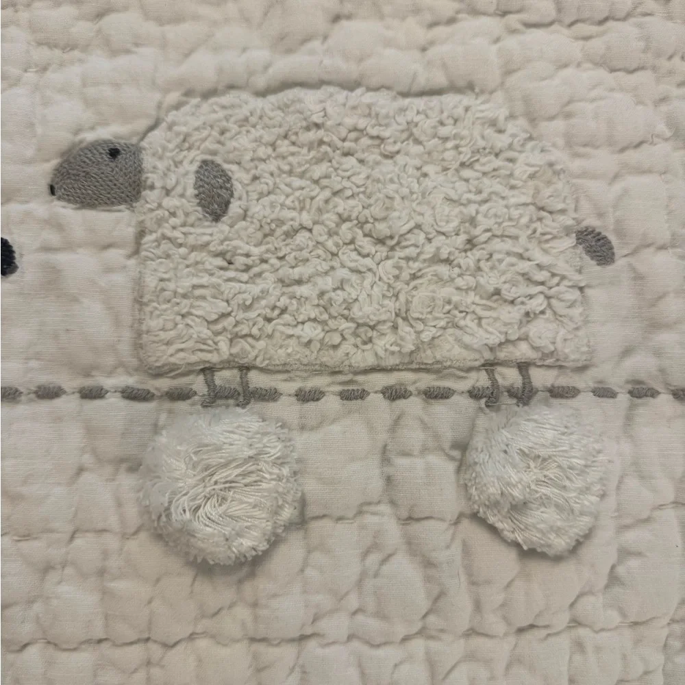 Pottery Barn Kids Shelby Sheep Baby Quilt features textured Sherpa sheep